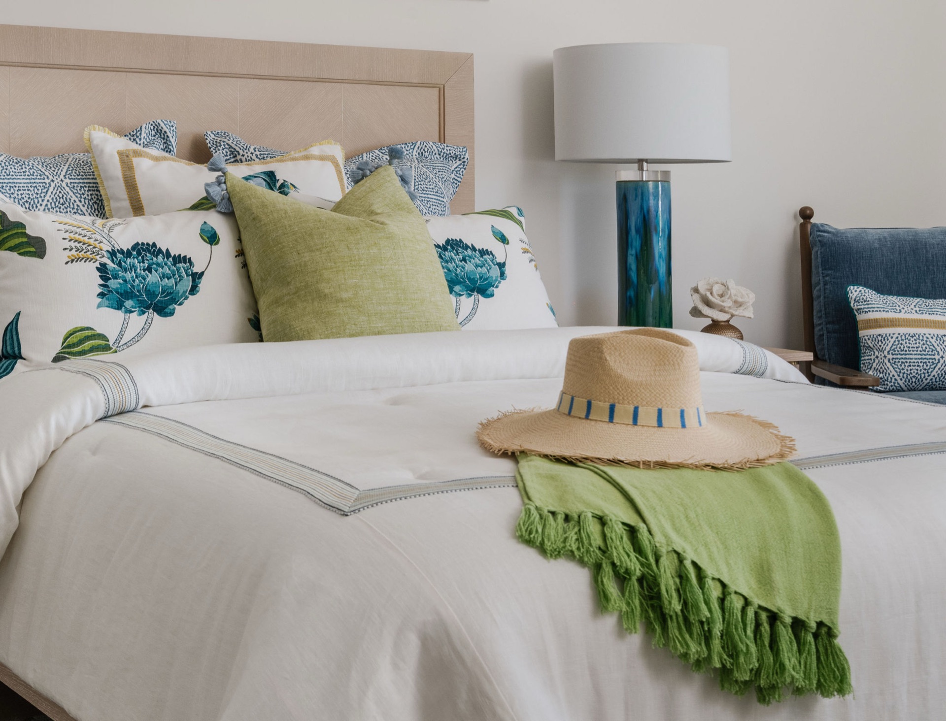 Serene bedroom detail with layered linens and a soft coastal palette by Oak Heart Interiors